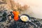 delicious and healthy Breakfast with eggs and coffee on a gas burner while camping in the mountains