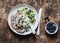 Delicious healthy breakfast - whole wheat pancakes with greek yogurt, blueberries, kiwi, honey and nuts on a wooden background, to