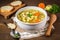 Delicious and healthy chicken noodle soup on a rustic table