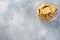 Delicious healthy cookies crackers with flax seeds and sesame seeds on a plate. Background of a healthy snack food, grey concrete