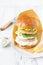 Delicious healthy crispy fish burger with greek yogurt sauce with lettuce and cucumber