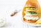 Delicious healthy crispy fish burger with greek yogurt sauce with lettuce and cucumber