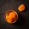 Delicious and healthy dried apricots. Freshly dried. On a dark background