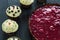 Delicious Healthy Raw Raspberry Tart with Valentines Day Red Velvet Cupcakes on Dark Wooden Background