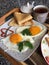 delicious healthy rich breakfast of eggs and pancakes with a hot drink