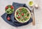 Delicious healthy salad of fresh strawberries, green asparagus, feta cheese, arugula, lettuce. Clean eating, lunch bowl.