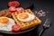 Delicious hearty breakfast consisting of a fried egg, Belgian waffle