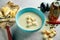Delicious and hearty cream cheese soup with croutons in a blue bowl on a wooden background. restaurant food