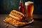 Delicious hearty hotdog set with sausage, french fries and glass of beer