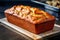 Delicious homemade banana bread on steel baking tray wooden board