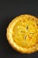 Delicious Homemade Canadian Tourtiere Meat Pie on a black surface, top view. Flat lay, overhead, from above. Copy space