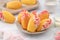 Delicious homemade chocolate dipped madeleine on white table background