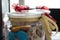 Delicious homemade colourful tasty christmas cookies and in a beautiful decorated jars with a candle in the back