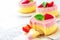Delicious homemade mango strawberry cheesecake white background Copy space Selective focus