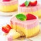 Delicious homemade mango strawberry cheesecake white background Copy space Selective focus Square image