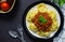 delicious homemade plate of spaghetti on black board