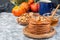 Delicious homemade pumpkin pancakes served with walnuts and honey, autumn decoration,  horizontal, copy space