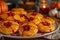 Delicious Homemade Pumpkin Shaped Cookies with Cherry Topping on Festive Autumn Table Setting