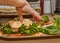 Delicious Homemade Salad with Crab Sticks and Fresh Lettuce on Marble Tray