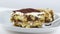 Delicious homemade tiramisu cake traditional Italian dessert on white background, dolly camera movement, nutrition