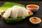 Delicious Idly served with sambar in banana leaf