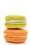 Delicious Isolated Orange and Green Stacked Macarons