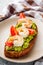 delicious Italian bruschetta with shrimps on a gray stone background