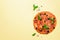 Delicious italian pizza, basil leaves, salt, pepper on yellow background with copyspace. Top view. Banner. Pattern for