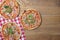 Delicious italian pizzas served on wooden table. Three pizza on rustic wooden background, copy space web design banner