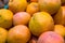 Delicious, juicy ripe grapefruits on the supermarket counter