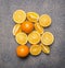 Delicious, juicy, ripe oranges, sliced granite rustic background top view close up