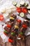 Delicious kebab with vegetables on skewers close-up. vertical to