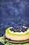 Delicious key lime cheesecake decorated with fresh blueberries