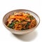 Delicious Korean Japchae with Sweet Potato Noodles in a Bowl on White Background .