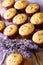 Delicious lavender muffins dessert close-up. vertical