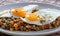 Delicious lentils with vegetable and fried egg