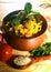 Delicious little millet food vegetable biryani in clay bowl with wood spoon full of millet