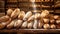 Delicious loaves of bread in a baker shop. Different types of bread loaves on bakery shelves