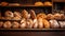 Delicious loaves of bread in a baker shop. Different types of bread loaves on bakery shelves