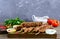 Delicious lula kebab on a wooden table. Chopped meat on wooden skewers, grilled.