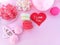Delicious macaron, decorate heart ribbon, pink background