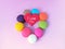 Delicious macaron, red heart shape, pink background