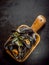 Delicious marinated mussels in a wooden dish