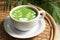 Delicious matcha latte in cup on coffee table, closeup