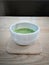 Delicious matcha milk tea in japanese style tea cup.