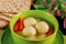 Delicious matzo ball soup with carrot and matzos bread. Close up