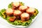 Delicious meatloaf with spinach, cheese and tomato on plate on white background