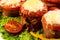 Delicious meatloaf with spinach, cheese and tomato on plate on white background