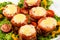 Delicious meatloaf with spinach, cheese and tomato on plate on white background