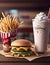 Delicious milk shake and fries, fast food on a wooden table